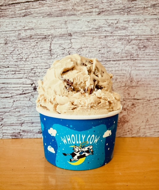 Butter Pecan Flavor Wholly Cow Ice Cream Scoop in a blue wholly cow branded cup