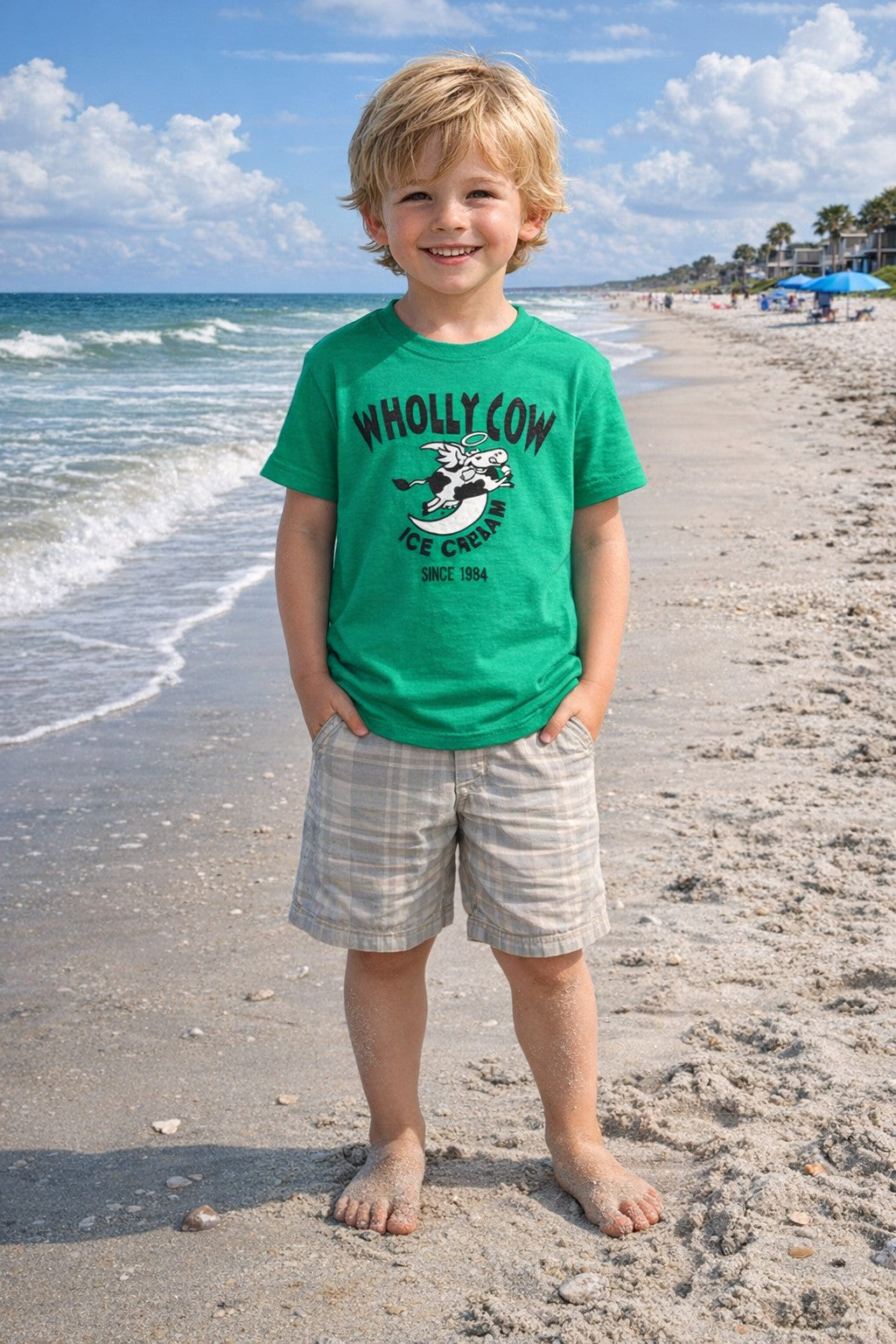 Child wearing a green 'Wholly Cow' t-shirt on Edisto beach
